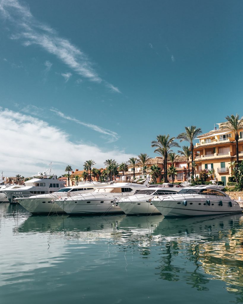The next image features the shipping marina and the shops available in the area, highlighting the vibrant waterfront lifestyle and amenities within Sotogrande Real Estate.