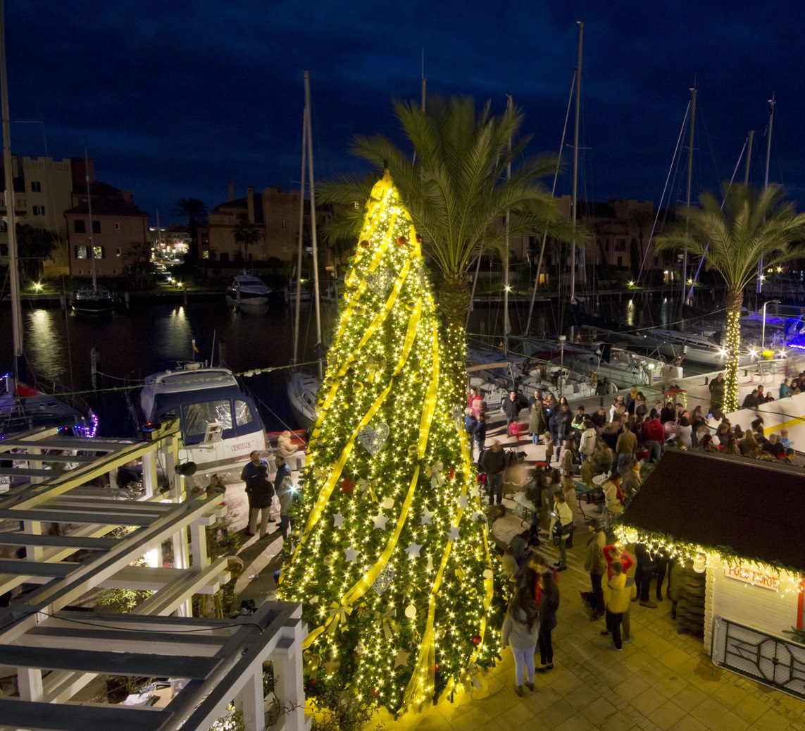 The next image features a large Christmas tree positioned in the center of a complex, adding to the holiday charm and festive spirit of Sotogrande Real Estate.