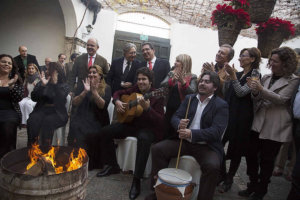 The next image portrays a traditional festive spirit with various people from the Sotogrande area playing musical instruments, adding to the joyful atmosphere of the season in Sotogrande Real Estate.