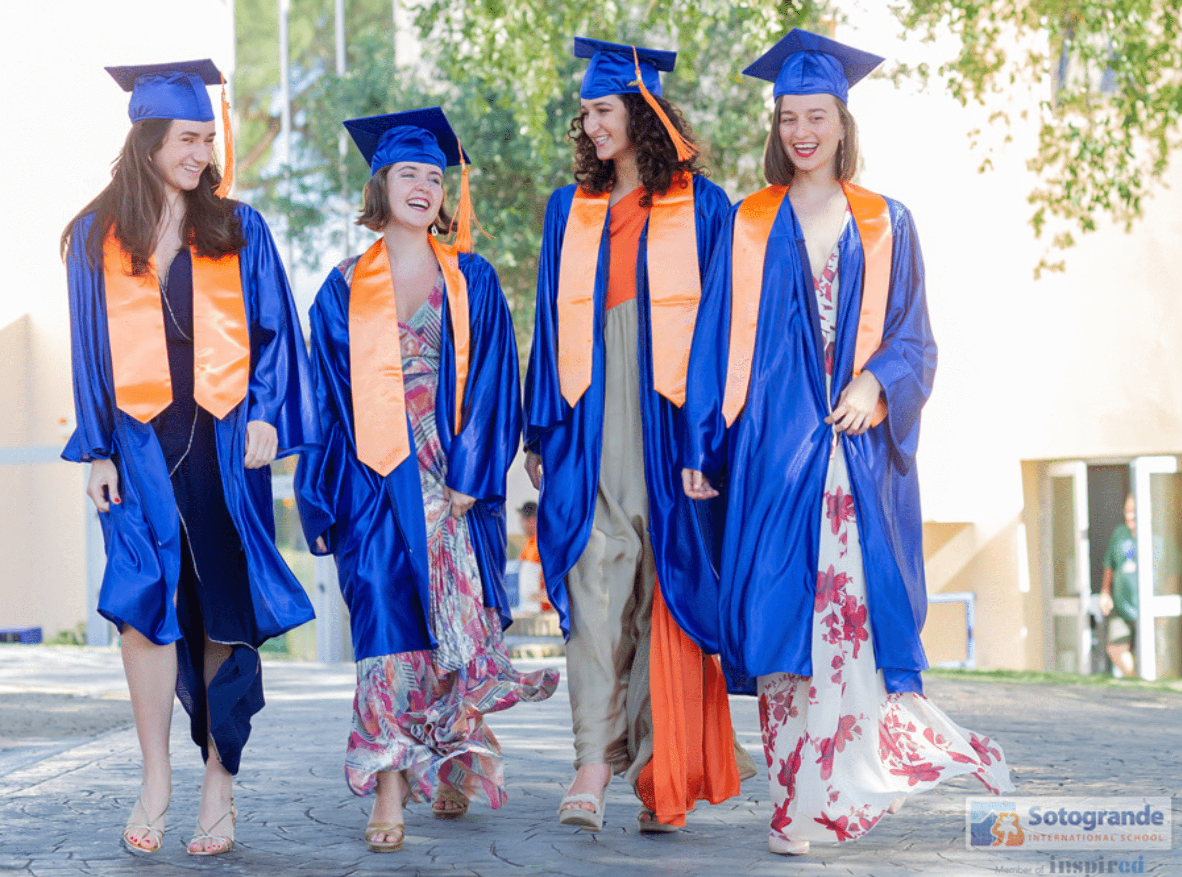 A group of female graduates celebrating their achievement after completing university, symbolizing success and new beginnings in their academic journey within the vibrant community of Sotogrande Real Estate.